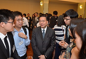 The Secretary for Transport and Housing, Professor Anthony Cheung Bing-leung (third left), talks with students to learn about their internships at the Maritime and Aviation Internship Network Cocktail Reception today (July 11).