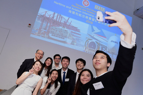 The Secretary for Transport and Housing, Mr Frank Chan Fan (back row, left), poses for a selfie with a group of students at the Maritime and Aviation Internship Scheme Cocktail Reception today (July 20).