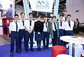 Ms Maisie Cheng, JP, Director of Marine, taking photos with students from the Maritime Services Training Institute.