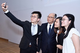 The Secretary for Transport and Housing, Mr Frank Chan Fan (second left) took a selfie with a group of students.