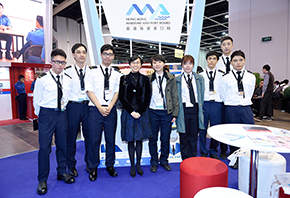 Ms Maisie Cheng, JP, Director of Marine, taking photos with students from the Maritime Services Training Institute.