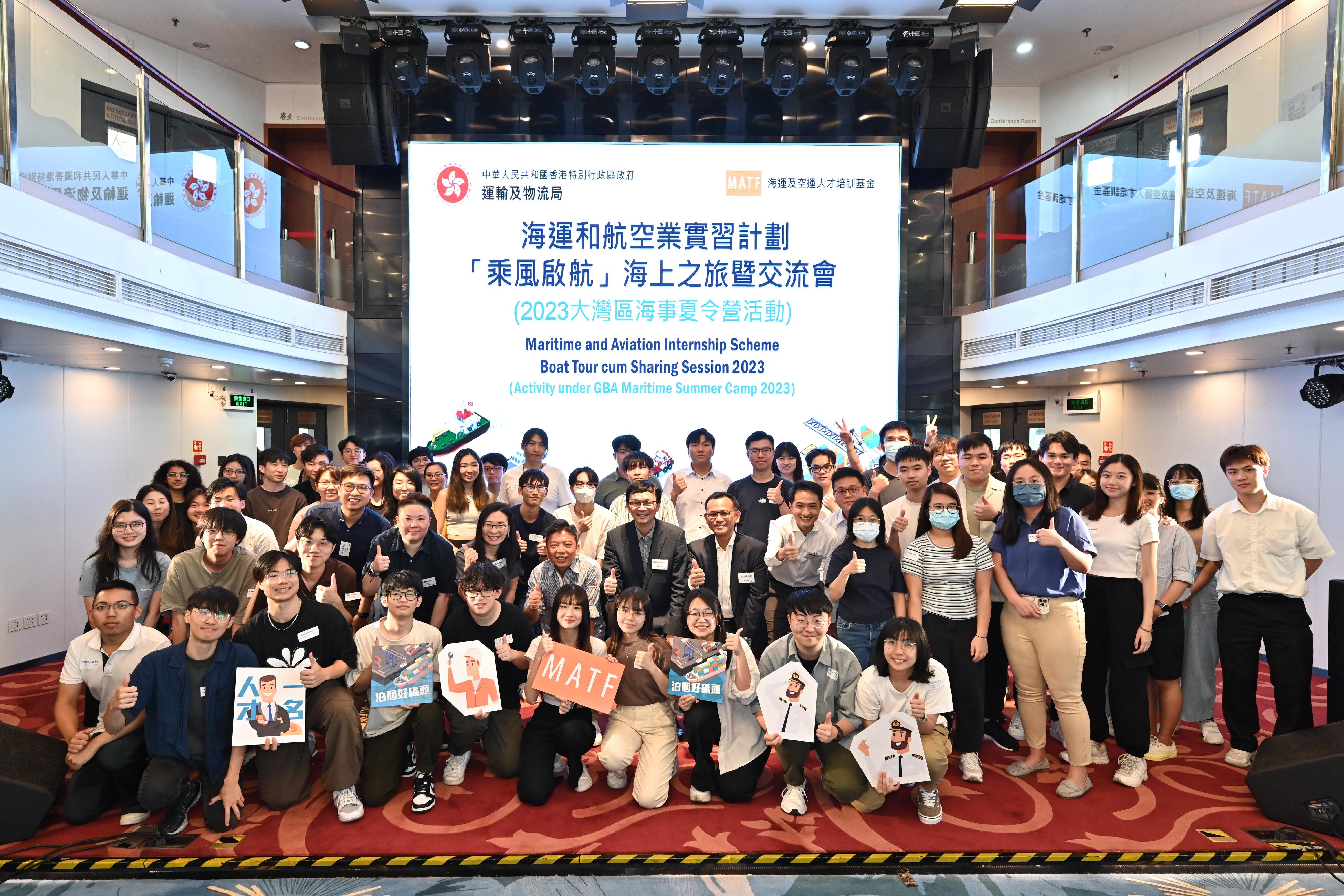 The Acting Secretary for Transport and Logistics, Mr Liu Chun-san (second row, centre), Deputy Secretary for Transport and Logistics Ms Amy Chan (second row, fifth left) and Chief Assistant Secretary for Transport and Logistics Miss Carmen Chan (second row, fourth left), together with representatives from the Marine Department and the maritime industry, pose for a group photo with participants at the Maritime and Aviation Internship Scheme Boat Tour cum Sharing Session today (July 14).