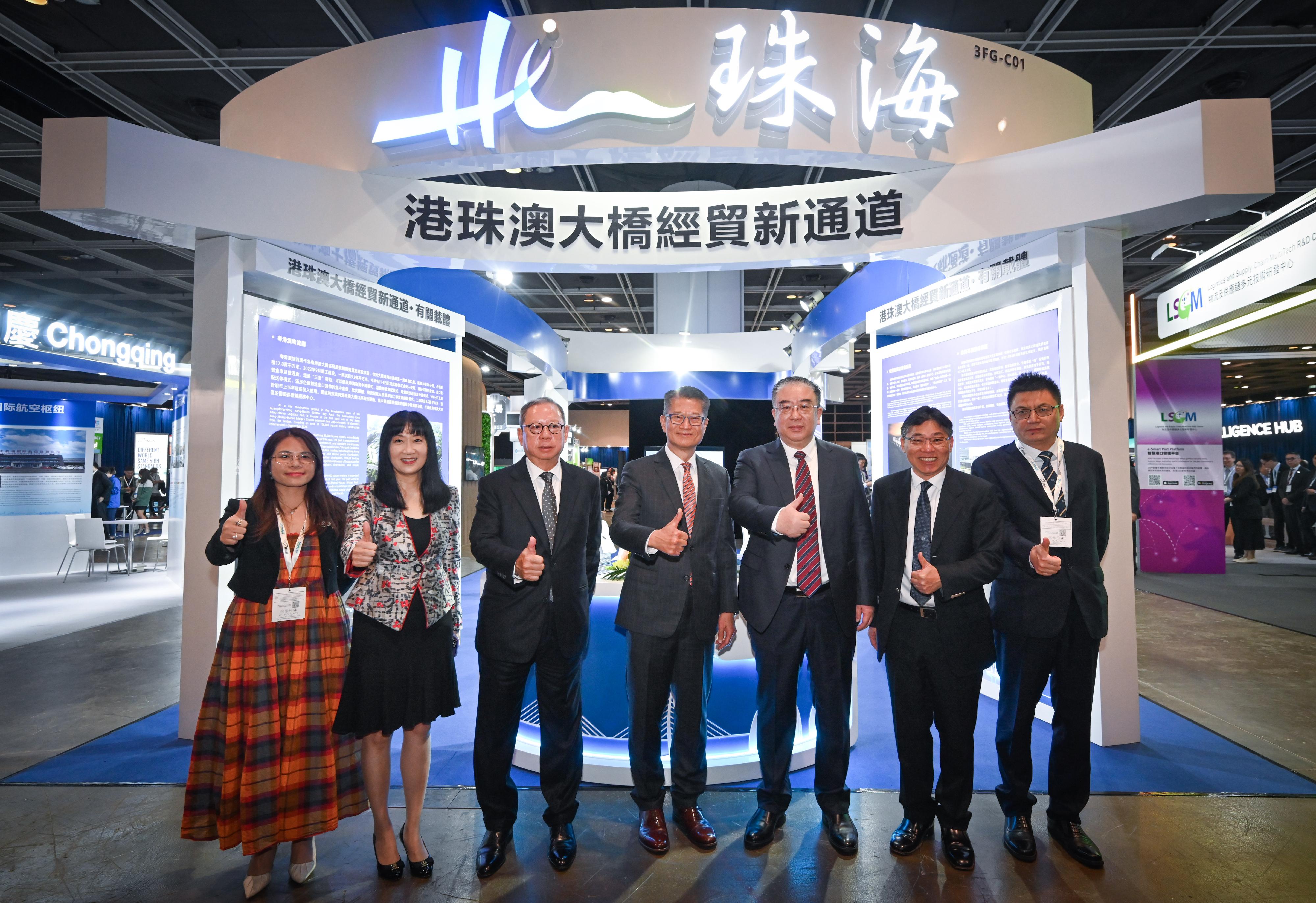 The Financial Secretary, Mr Paul Chan, attended the Asian Logistics, Maritime and Aviation Conference 2023 and toured the exhibition today (November 21). Photo shows (from second left) the Executive Director of the Hong Kong Trade Development Council (HKTDC), Ms Margaret Fong; the Chairman of the HKTDC, Dr Peter Lam; Mr Chan; Vice Minister of Transport Mr Fu Xuyin; the Secretary for Transport and Logistics, Mr Lam Sai-hung, and other guests at the exhibition.