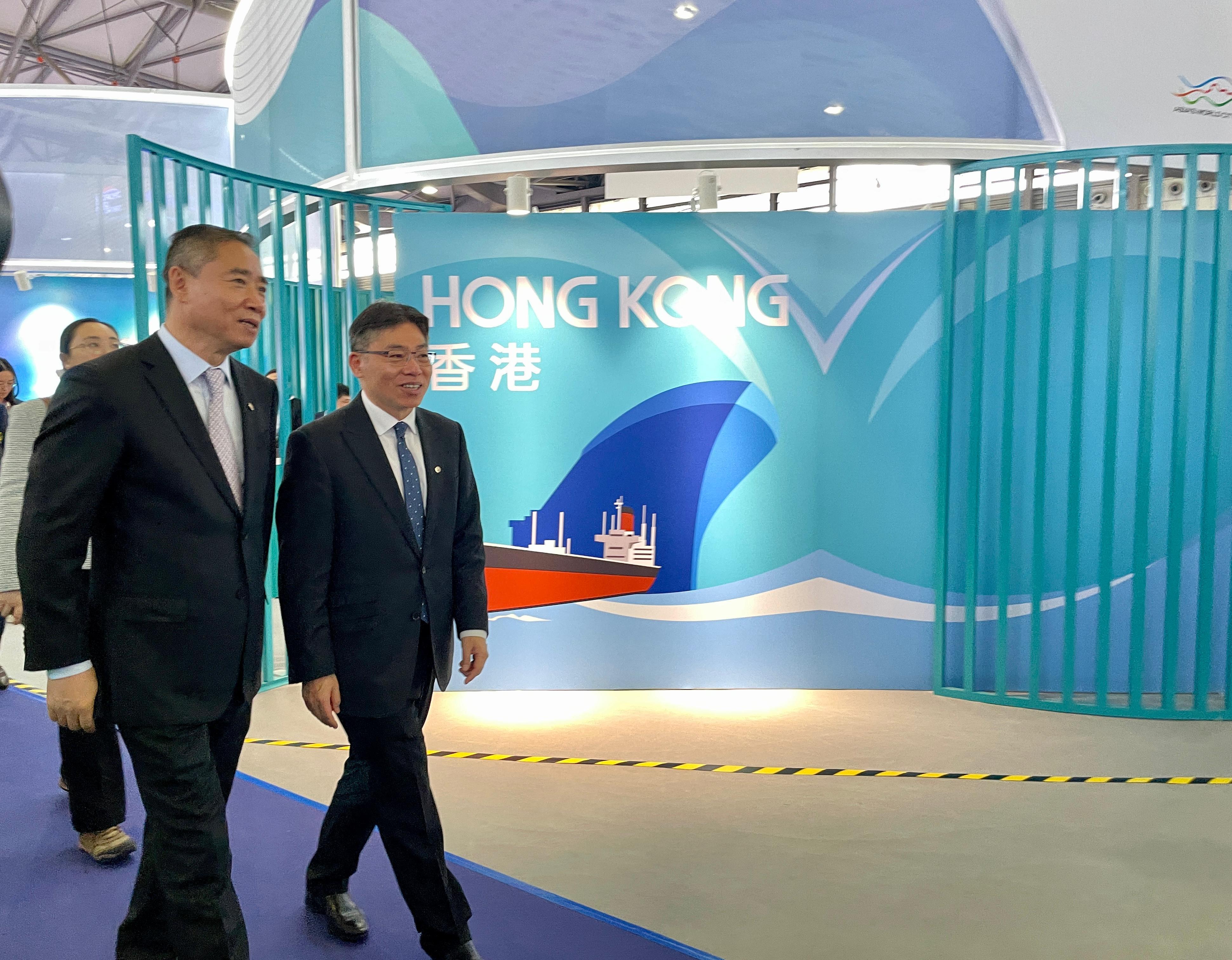 The Chairman of the Hong Kong Maritime and Port Board and Secretary for Transport and Logistics, Mr Lam Sai-hung (right), visits the Marintec China 2023 in Shanghai and introduces the China Hong Kong Pavilion to Vice Minister of the Ministry of Industry and Information Technology Mr Xin Guobin (left) today (December 5).