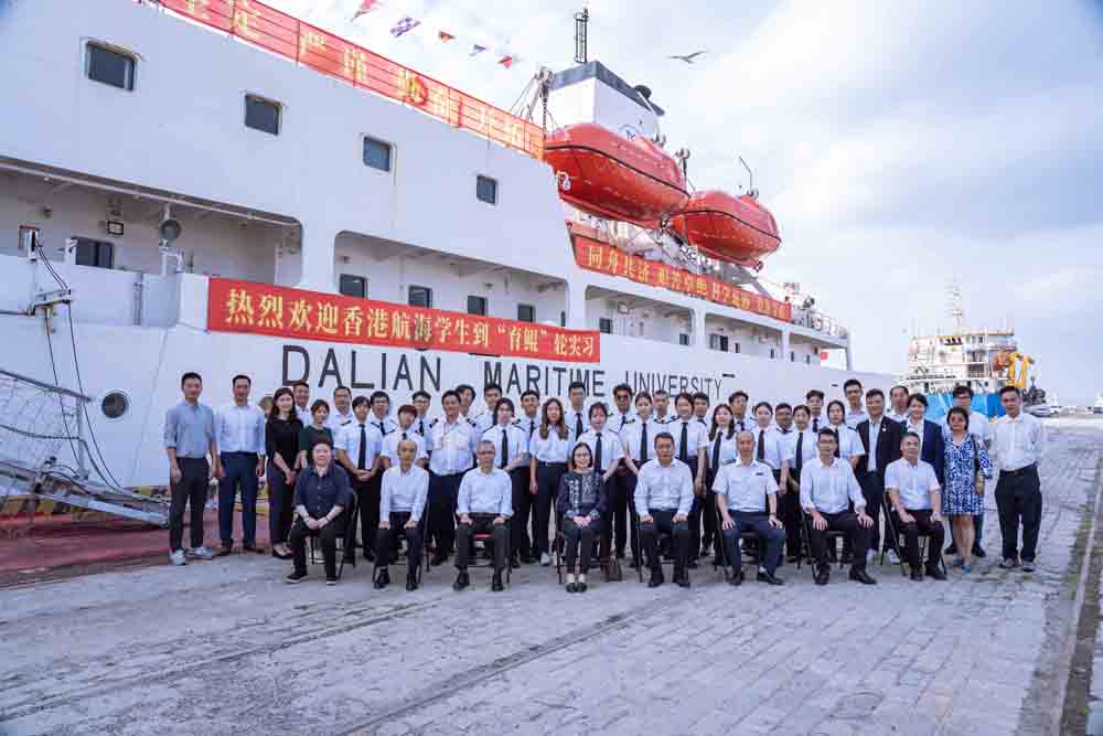 Group photo of Hong Kong delegation, participating students and representatives from Dalian Maritime University taken in front of "M.V. Yu Kun"
